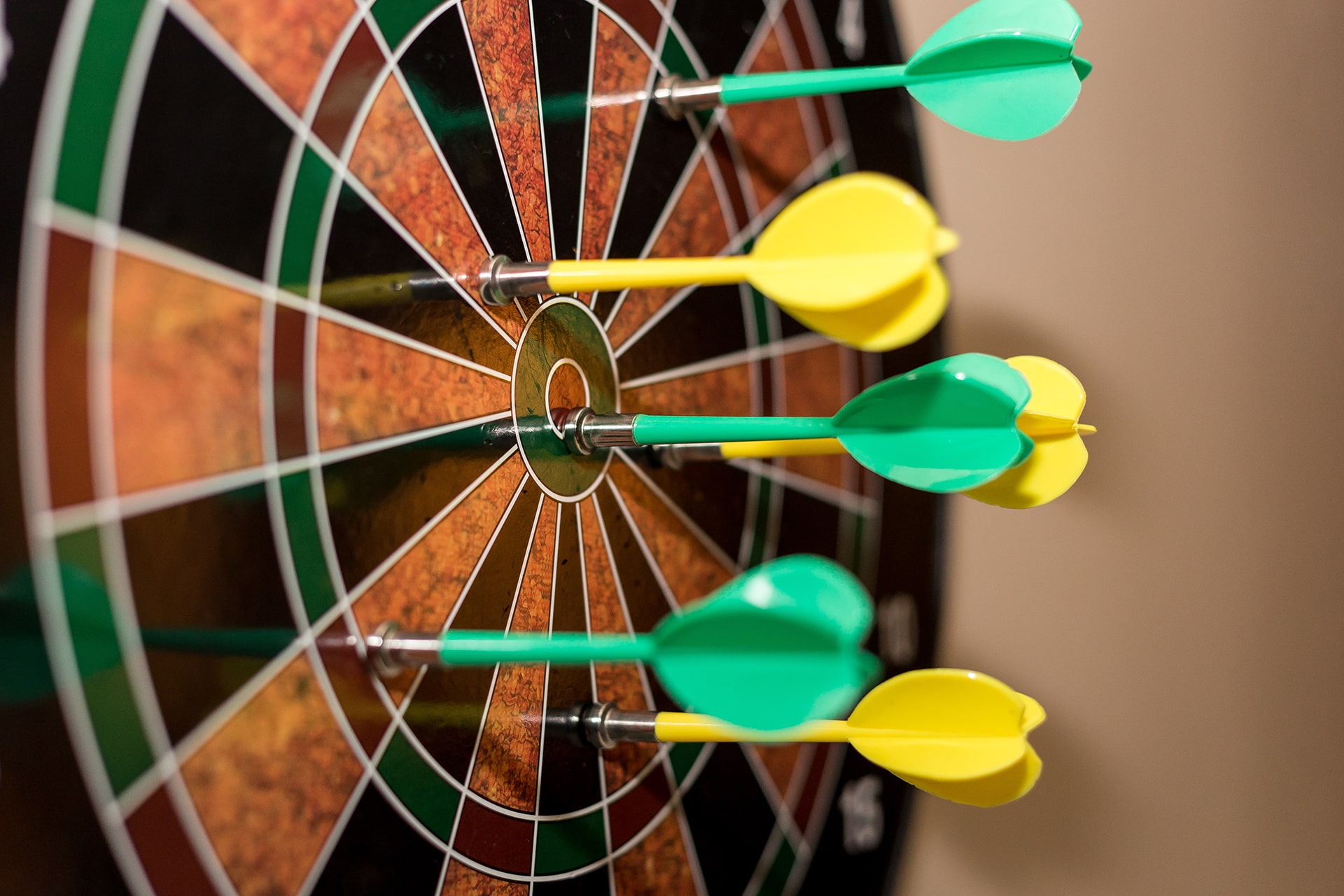 Dart board with darts in it